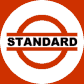 Rot–weißes Werbeschild mit schwarzem Schriftzug „STANDARD”.