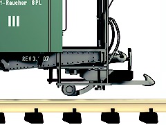 Foto: Modellbahn–Kupplung an einem Reisezugwagen von der Seite gesehen.