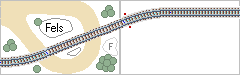 Gleisplan–Ausschnitt mit S–Bogen, der zwischen Felsen und Bäumen hindurch führt.
