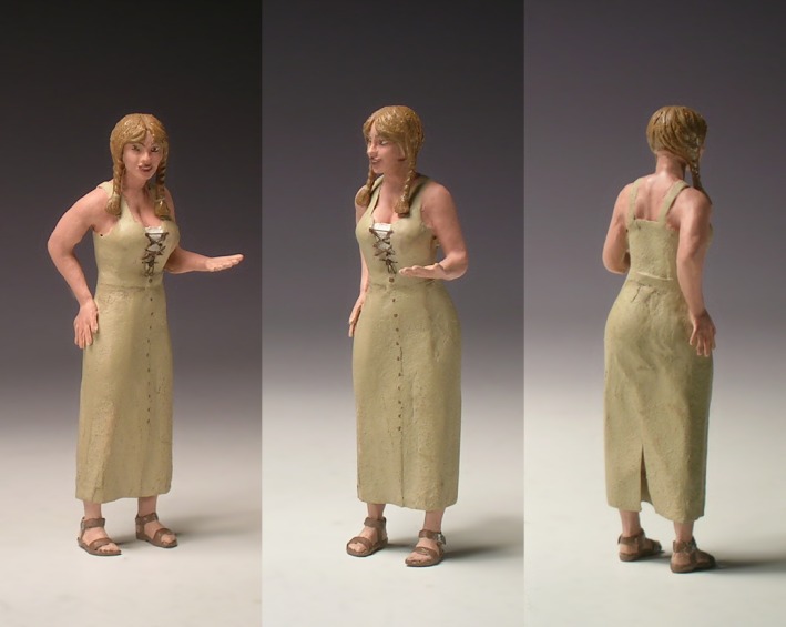 Modellfigur einer Frau in einem ländlichen Kleid, aus drei Blickwinkeln gesehen.